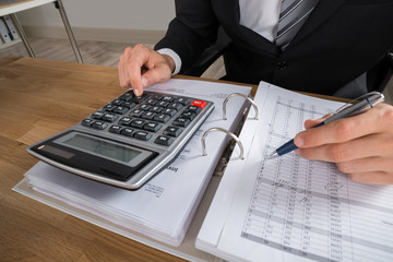 Male Accountant Calculating Tax