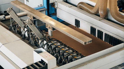 Industrial machinery used for the production of panels and sheet