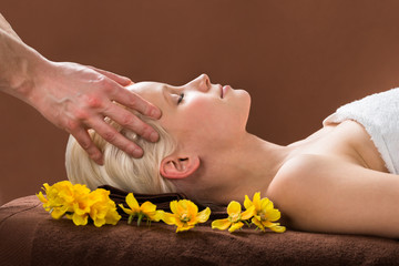 Obraz na płótnie Canvas Young Woman Receiving Massage At Spa