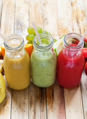 Row Juices Smoothie Bottles Red Green Orange Fruit