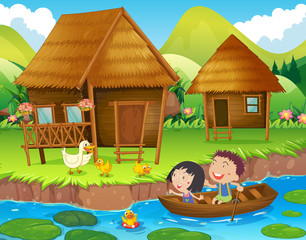 Two kids rowing boat in the river © GraphicsRF