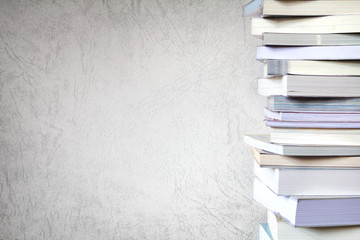 Close up book stacked  with concrete wall background