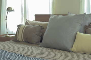 Linen pillows in difference size on bed in modern japanese style