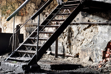 metal stairs in abandoned factory