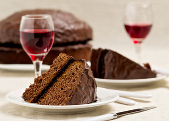 Chocolate cake and glasses of wine.