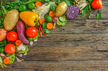 Fresh Vegetables on Wooden Background. Healthy Food. Vegetarian food, Organic Food. Vegetables on wooden table from above.