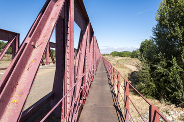 Old iron bridge over the River Esla, in Leon Province, Spain
