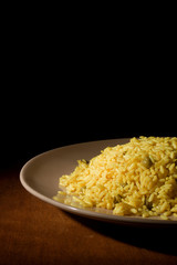 Risotto with Saffron on wooden table