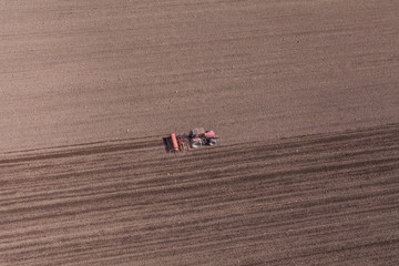 aerial view of  tractor on harvest field