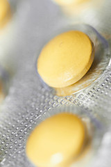Yellow medical pills in blister pack
