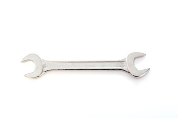 Wrench on white background, selective focus