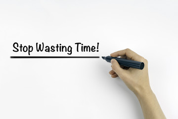 Hand with marker writing: Stop Wasting Time!