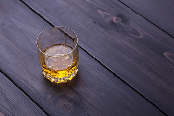 Whiskey on dark wood
