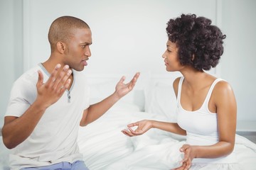 Couple having argument in bedroom