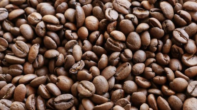 Arabica coffee beans shallow DOF tilt 4K 2160p UHD footage - Slow tilting over roasted coffee beans arabica type background 4K 3840X2160 UlraHD video 