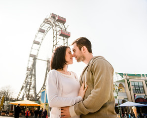 Young couple dating in amusement park