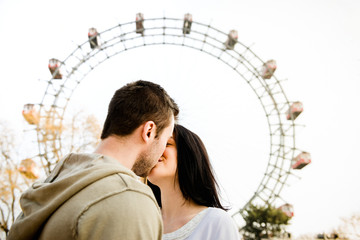 Young couple dating in amusement park