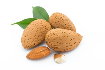 Almonds with leaves isolated on white background