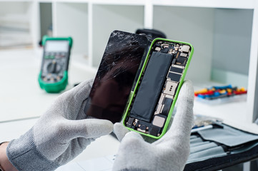 Close-up photos showing process of mobile phone repair