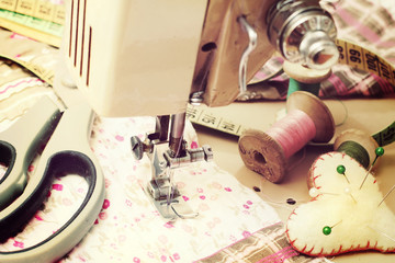 sewing machine, dressmaker scissors and thread-style retro