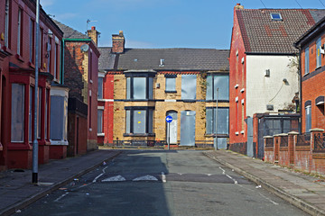 A street of boarded up derelict houses awaiting regeneration in Liverpool UK