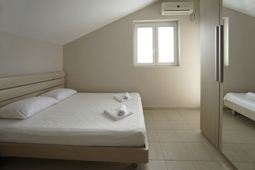 Fototapeta na wymiar Interior of a modern bedroom in a guest house in Herceg-Novi, Montenegro