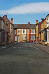 A street of boarded up derelict houses awaiting regeneration in Liverpool UK - 107505060