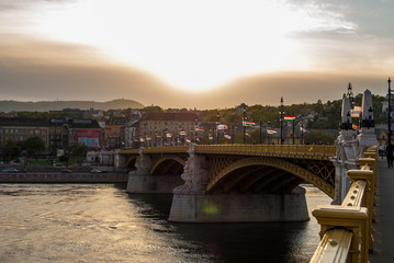 Margit or Margaret Bridge in Budapest, Hungary. It connects Buda and Pest across the Danube. Against spectacular sunset.