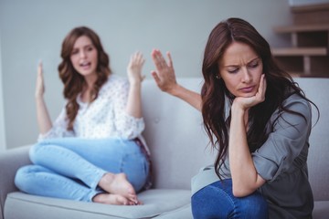 Two female friends arguing with each other