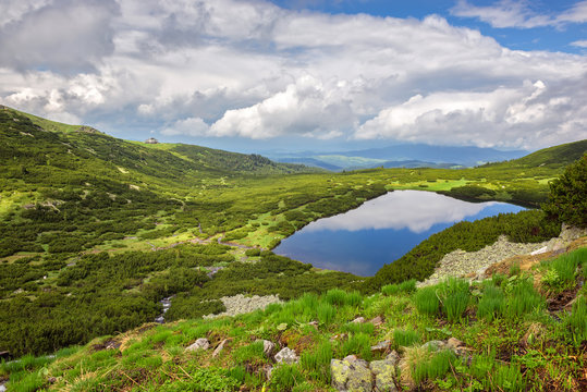 Magnificent spring view of the Rila mountains and one of its famous Seven Rila lakes