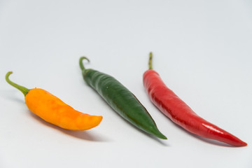Fresh colorful chilli pepper with white background and selective focus
