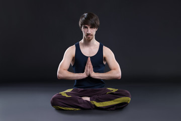 boy meditating indoors