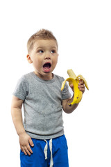 Portrait of young playful boy with banana