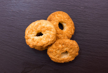 Some cookies on a slate top seen from above