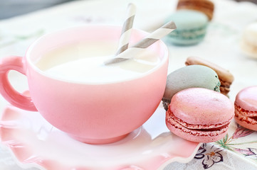 Pink Macarons and Milk with shallow depth of field.