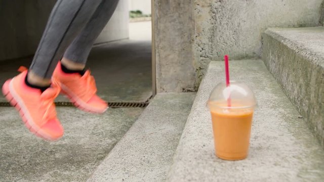 Urban stairs toe taps exercise workout. Woman training hiit outside. Close up of female athlete feet training.