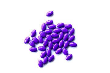 purple pills on white background isolated