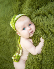 newborn baby lying on stomach