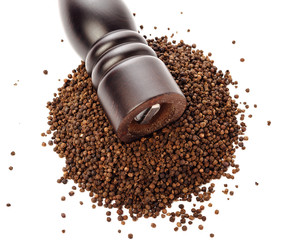 pepper mill on peppercorns heap, isolated on white