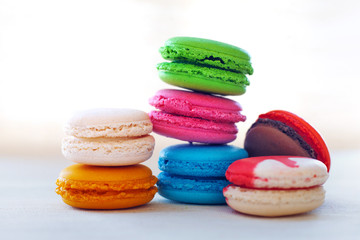 Colorful macaroons tower close-up on whitebackground. 