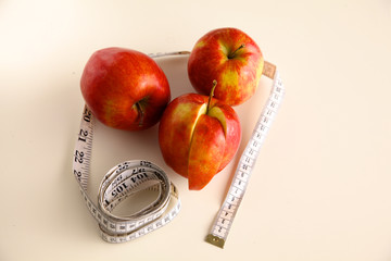 Stethoscope with red apples on a white background