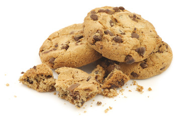 stacked crunchy chocolate chip cookies on a white background
