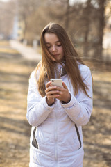 Fototapeta premium Beautiful girl takes a picture of the self, smiling
