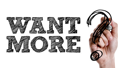 Hand writing the text: Want More?