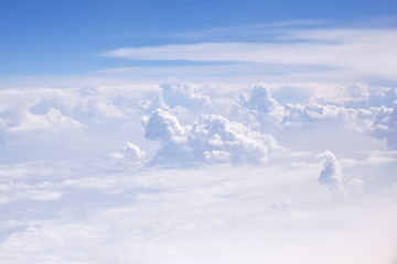 Fototapeta na wymiar Blue cloudy sky. View from porthole