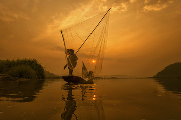 Fishermen when fishing in the mekong river , Thailand