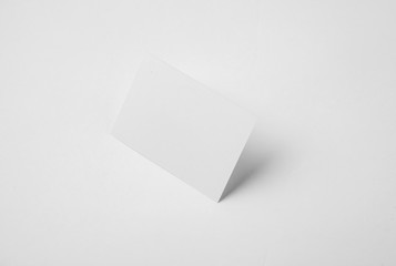 Photo of white identity stack. Empty business cards on abstract background, ready for your personal information. Horizontal mockup    