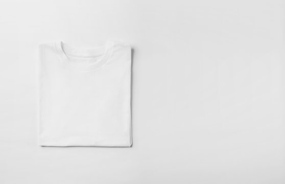 Photo of blank tshirt on white background. Wide © SFIO CRACHO