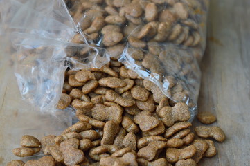 dog food pour from plastic bag