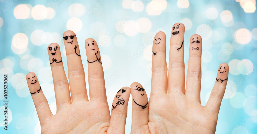 Wall mural close up of hands and fingers with smiley faces